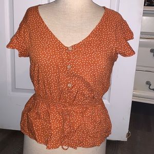 Orange with polka dot blouse